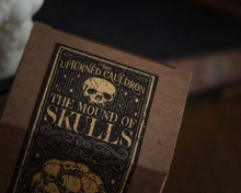 Load image into Gallery viewer, The Mound of Skulls Candle - The Upturned Cauldron