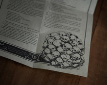 Load image into Gallery viewer, The Mound of Skulls Candle - The Upturned Cauldron