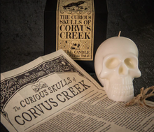 Load image into Gallery viewer, The Curious Skulls of Corvus Creek Candle - The Upturned Cauldron