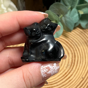 Hugging Black Obsidian Cats